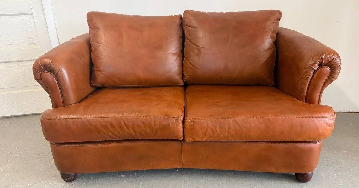 Restored brown leather loveseat by Leather Monkey Studio