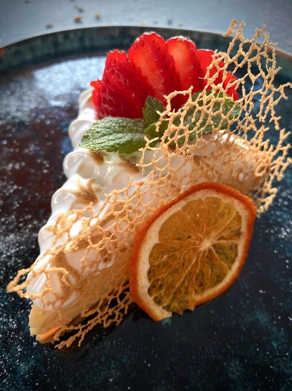 Plated dessert with sugar lace