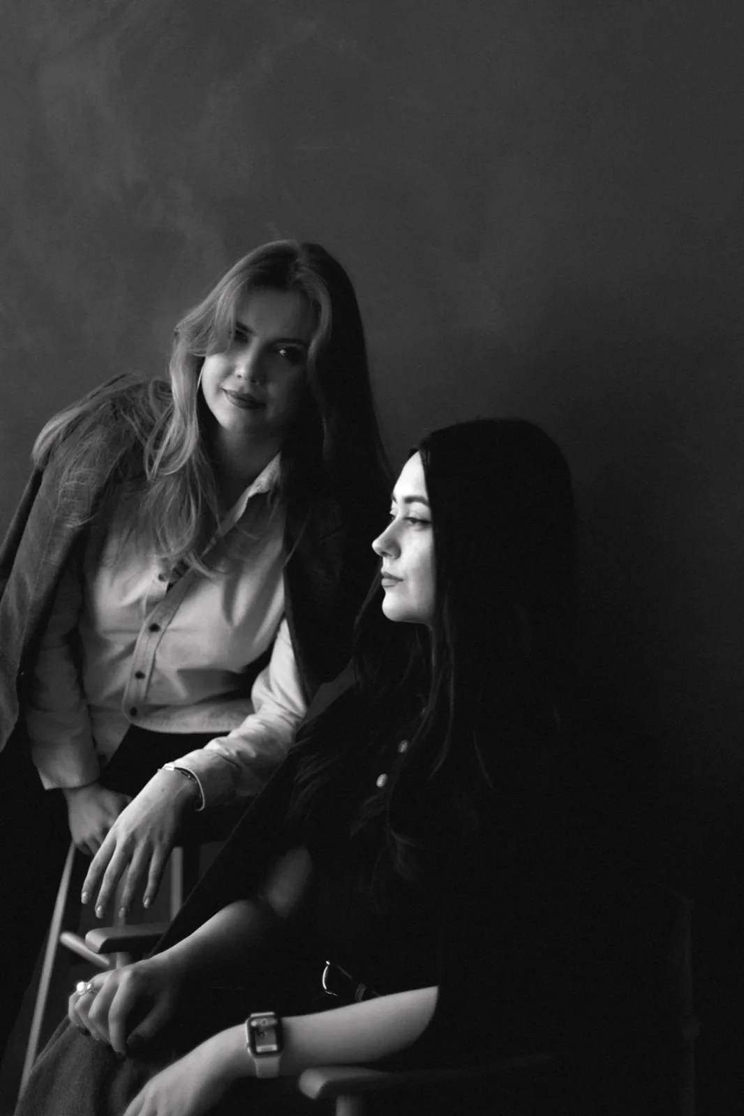 Two Syntri Labs founders in a serious black-and-white portrait.