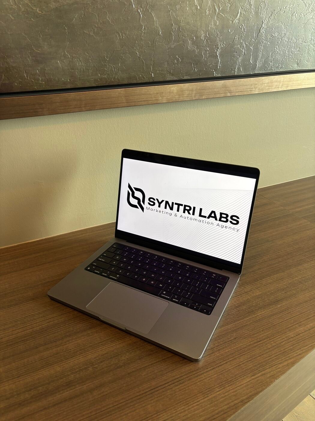 A laptop on a desk in the Syntri Labs office in Calgary